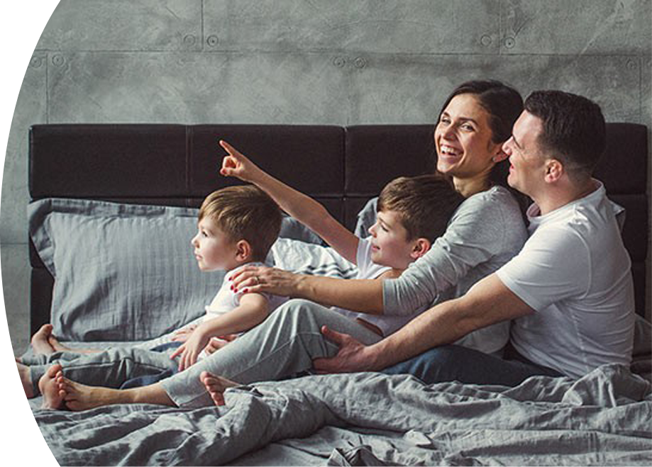 Family Enjoying Time on Bed with Air Conditioning