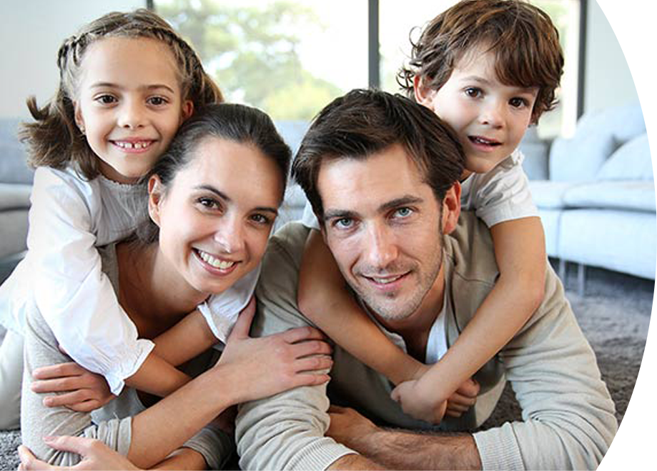 Portrait of a happy family enjoying the cool comfort of air conditioning on a warm summer day.